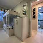 POS001 - APTO 2 Quartos com Ar Condicionado, Vista Av Brasil ao lado Shop Atlântico, Telas de Proteção, Garagem e Internet
